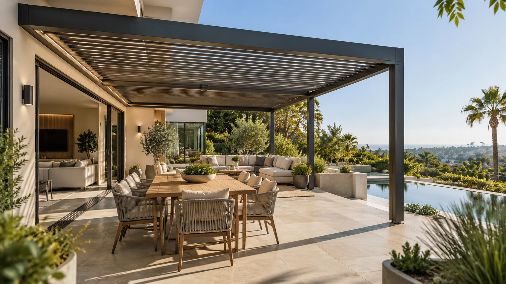 Attached louvered pergola extending from a modern Orange County home over an outdoor dining area