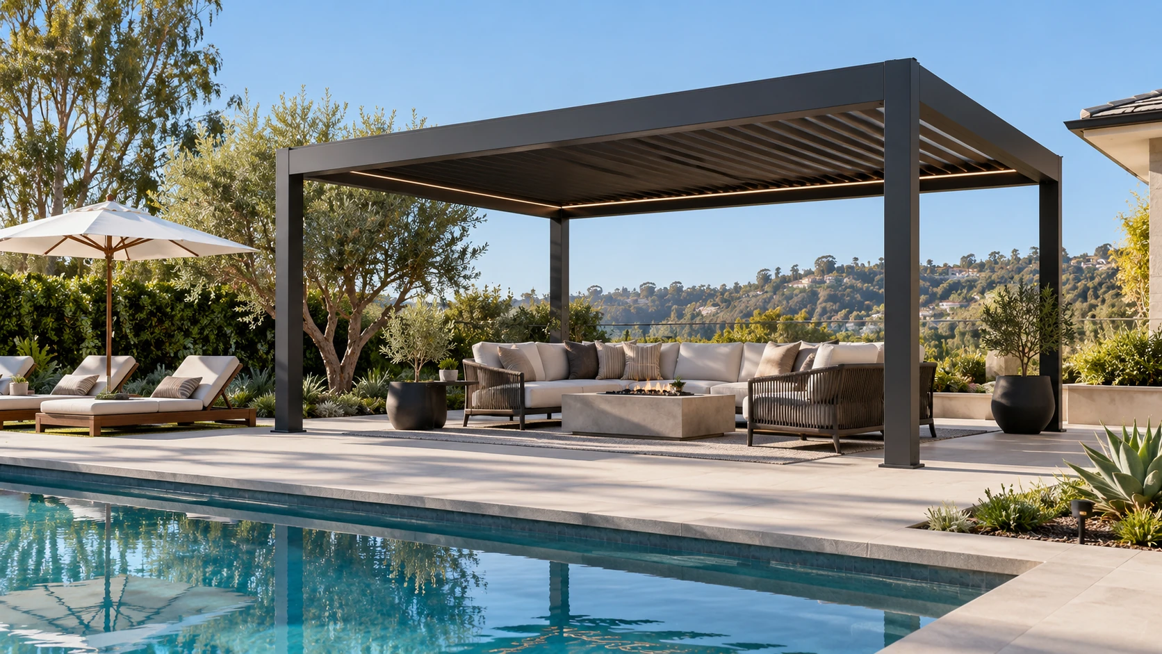 Freestanding louvered pergola beside a pool at an Orange County property