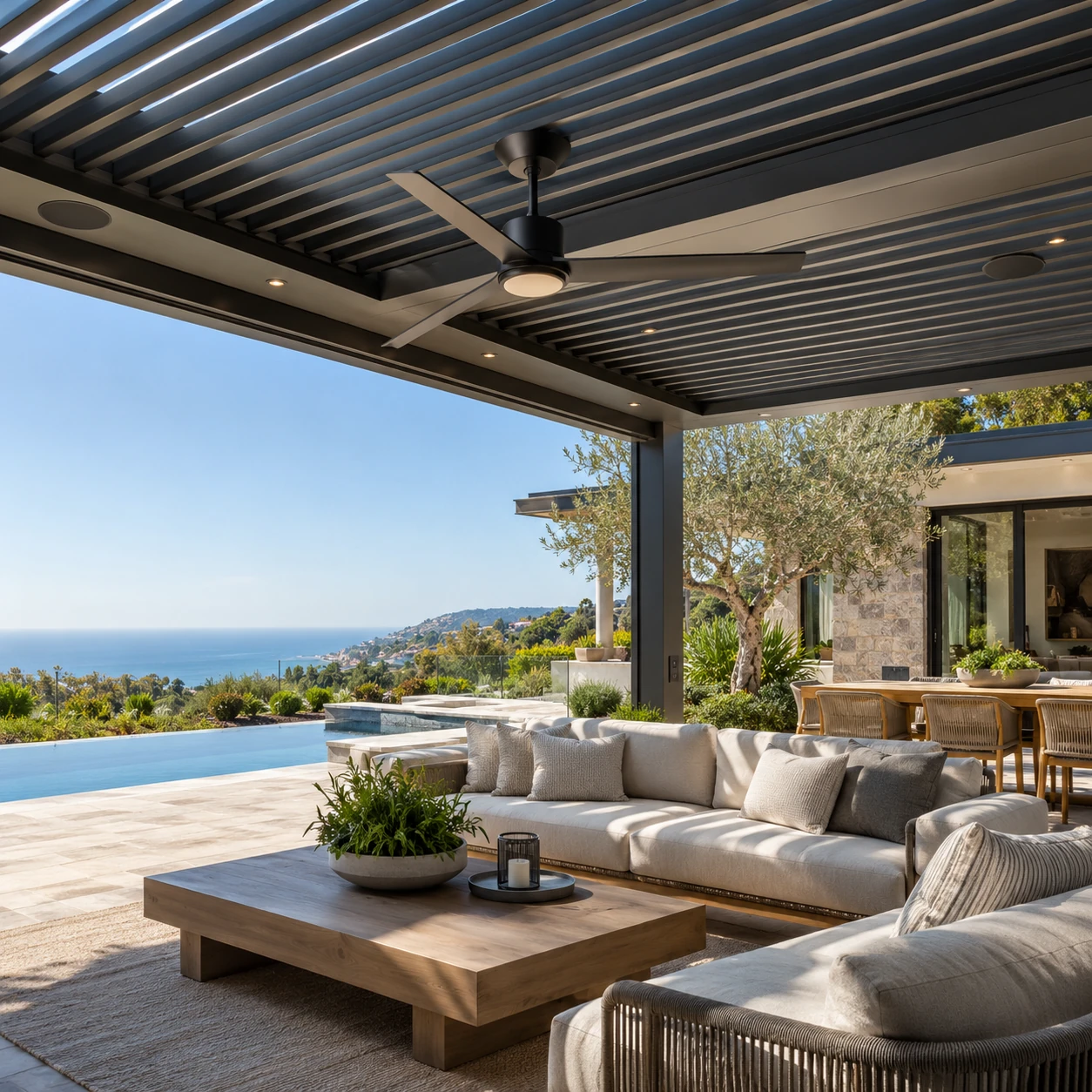 Ceiling fan and integrated accessories installed in a modern louvered pergola in Orange County
